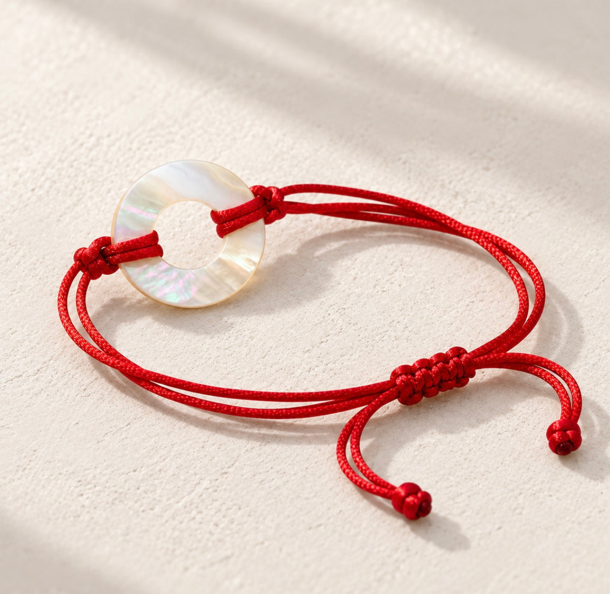 Pulsera de hilo con dije Madre Perla